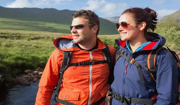 Man and Woman In Waterproof Hiking Jackets