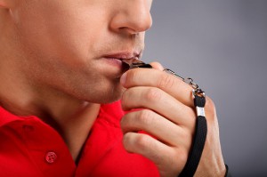 Man Blowing Whistle