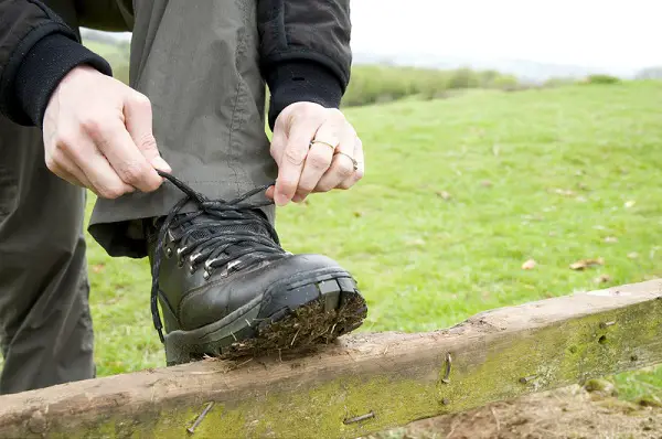 Hiker Tying Hiking Boot