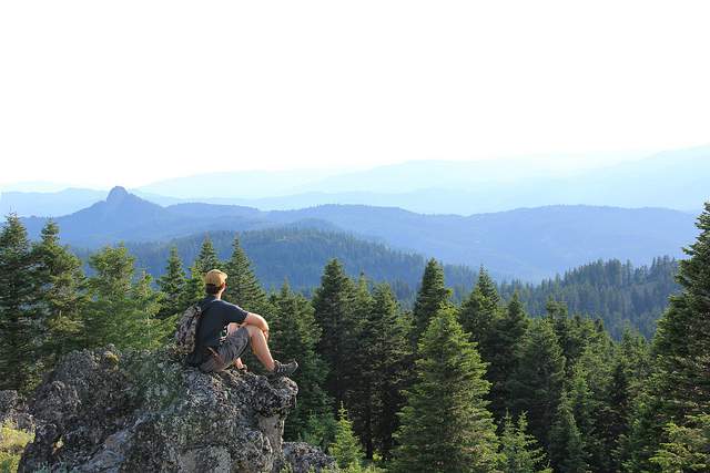 Hiker Sitting In Reflection