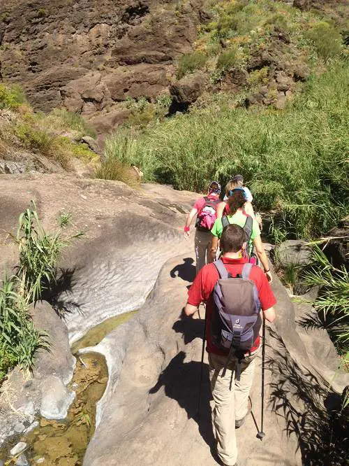 Hikers On Rocky Ground